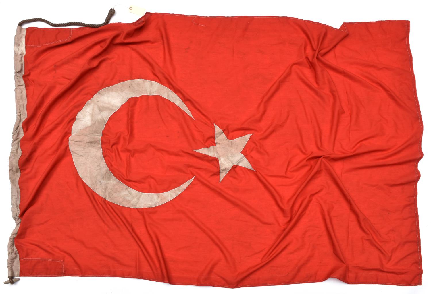 A white on red double sided flag with applied Ottoman star and crescent, the hoist stamped with