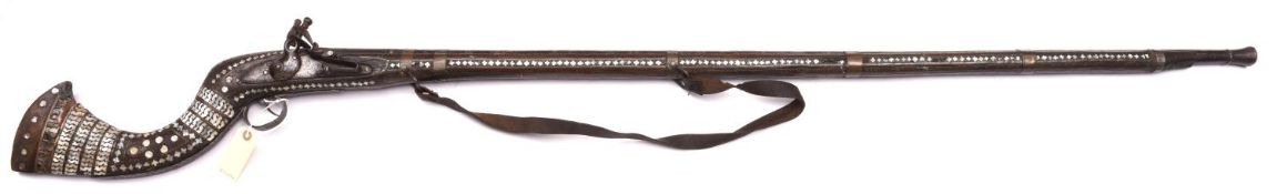 A decorative Indian flintlock gun, 65” overall, barrel 50”, with EIC musket lock and fullstock