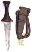 A Sudanese arm dagger, blade 5”, flared darkwood grip, in its leather sheath with plaited bands