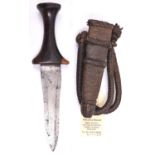 A Sudanese arm dagger, blade 5”, flared darkwood grip, in its leather sheath with plaited bands