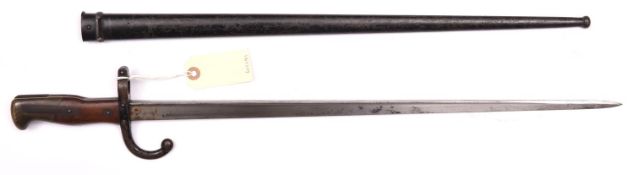 A Gras bayonet, marked “Mre d’Armes de St Etienne Avril 1879”, in scabbard with matching no. 25422