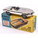 Corgi Toys 'E' Type Jaguar (312). A vacuum plated silver example with black seats, RN2, complete