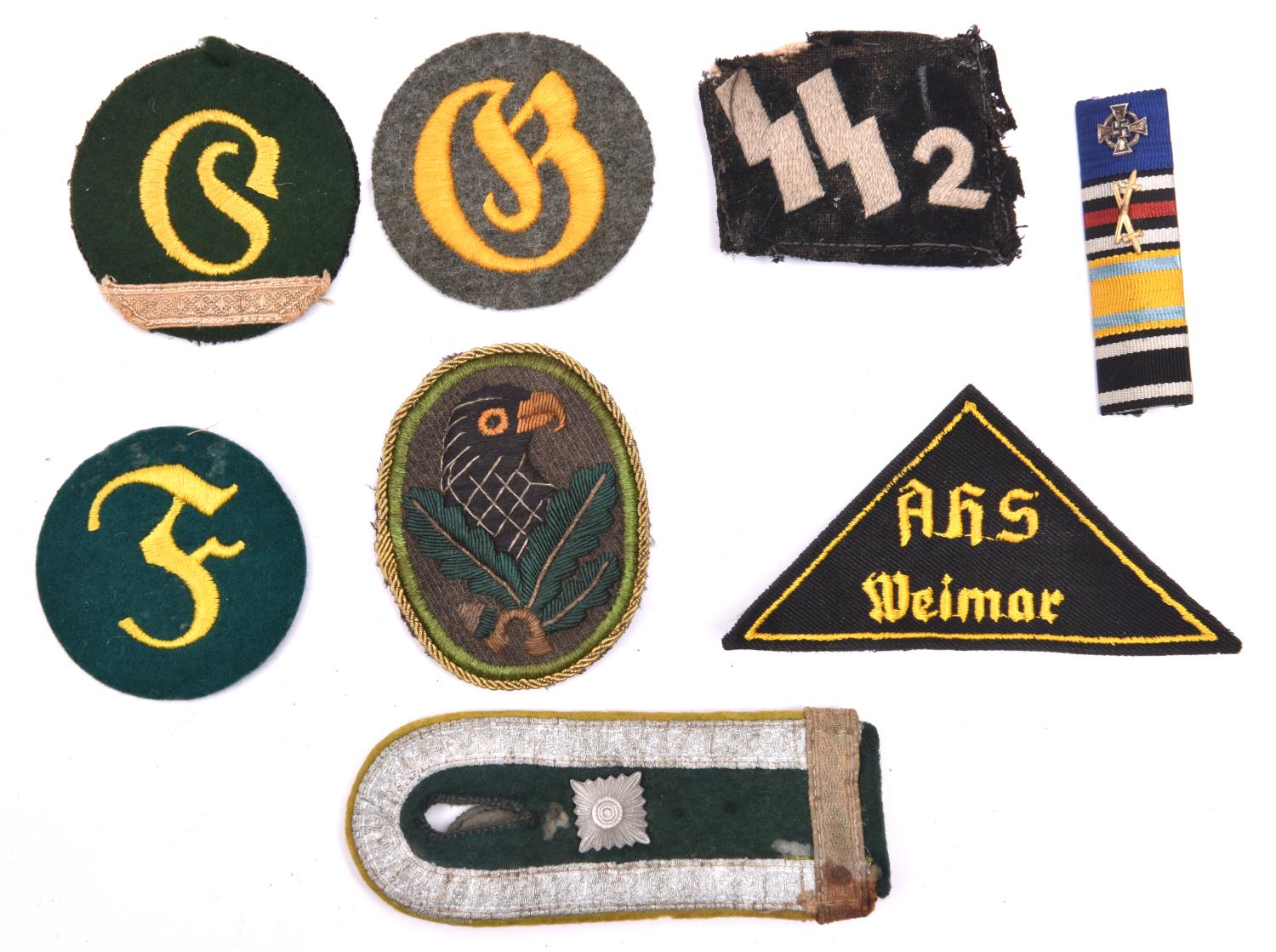 Third Reich cloth insignia: embroidered Sniper’s badge; SS collar patch (mothed and worn); feldwebel