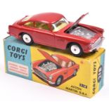 Corgi Toys Aston Martin DB4 (218). A scarce example in red with yellow interior, closed bonnet vent,