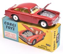 Corgi Toys Aston Martin DB4 (218). A scarce example in red with yellow interior, closed bonnet vent,