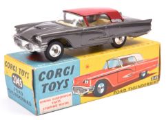Corgi Toys Ford Thunderbird (214S). Example in dark metallic grey with red roof and yellow interior.