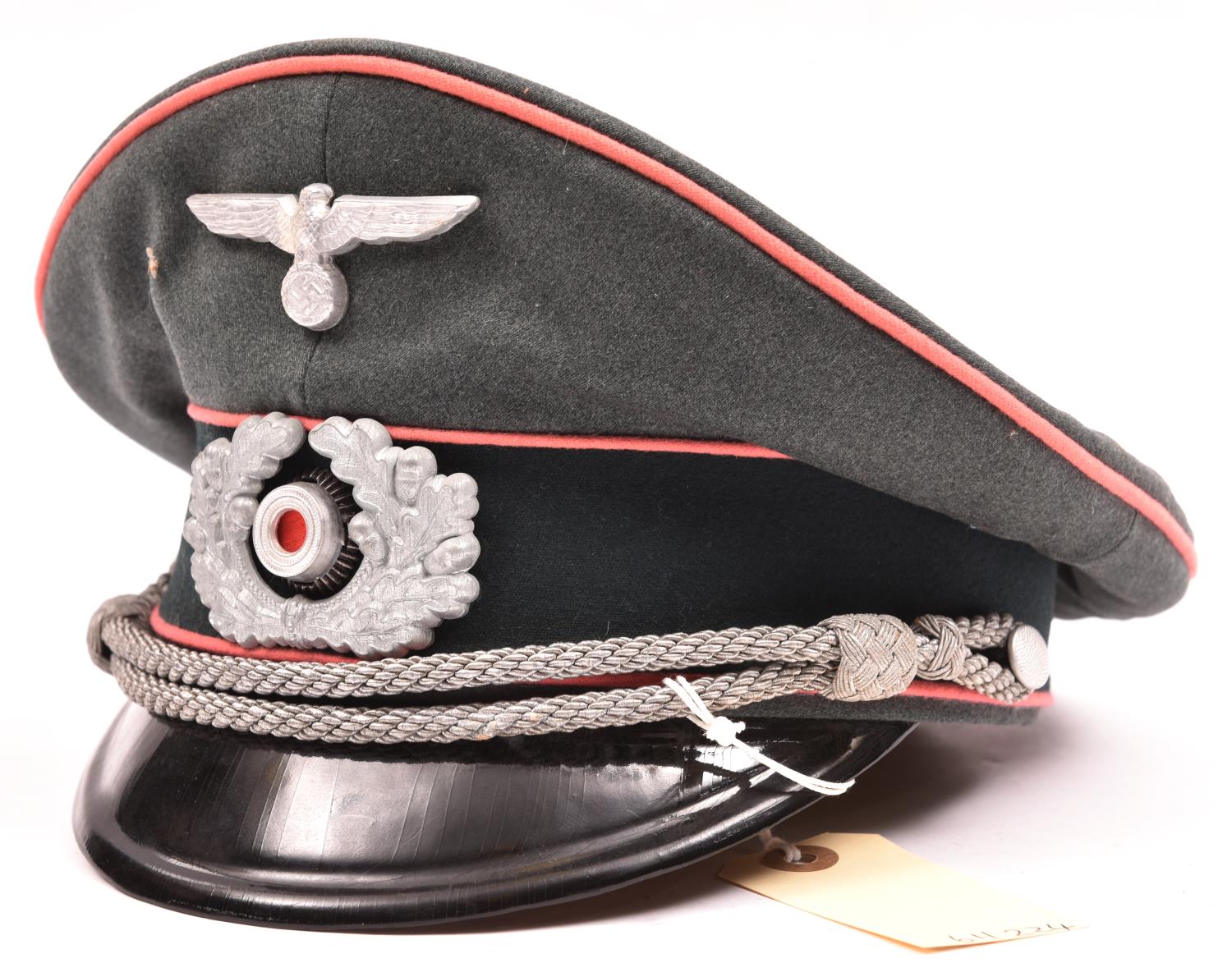 A Third Reich Panzer officer’s peaked cap, with aluminium eagle and cockade, pink piping, silver
