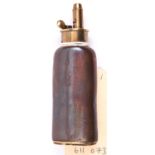 A copper 3 way pistol flask, ball and cap compartments to brass base with floral swivel covers,