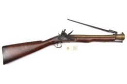 A brass barrelled flintlock blunderbuss with spring bayonet, by Wheeler, c 1800, 29½” overall,