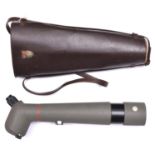 A Japanese “Kowa” spotting telescope, textured green finish overall, with anti glare extension,
