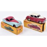 2 Dinky Toys. Morris Oxford Saloon (159). An example in cerise and cream with beige wheels. Together