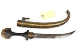 A Moroccan jambiya, blade 8½” pierced with dumb bell shape at the forte, the hilt of dark wood