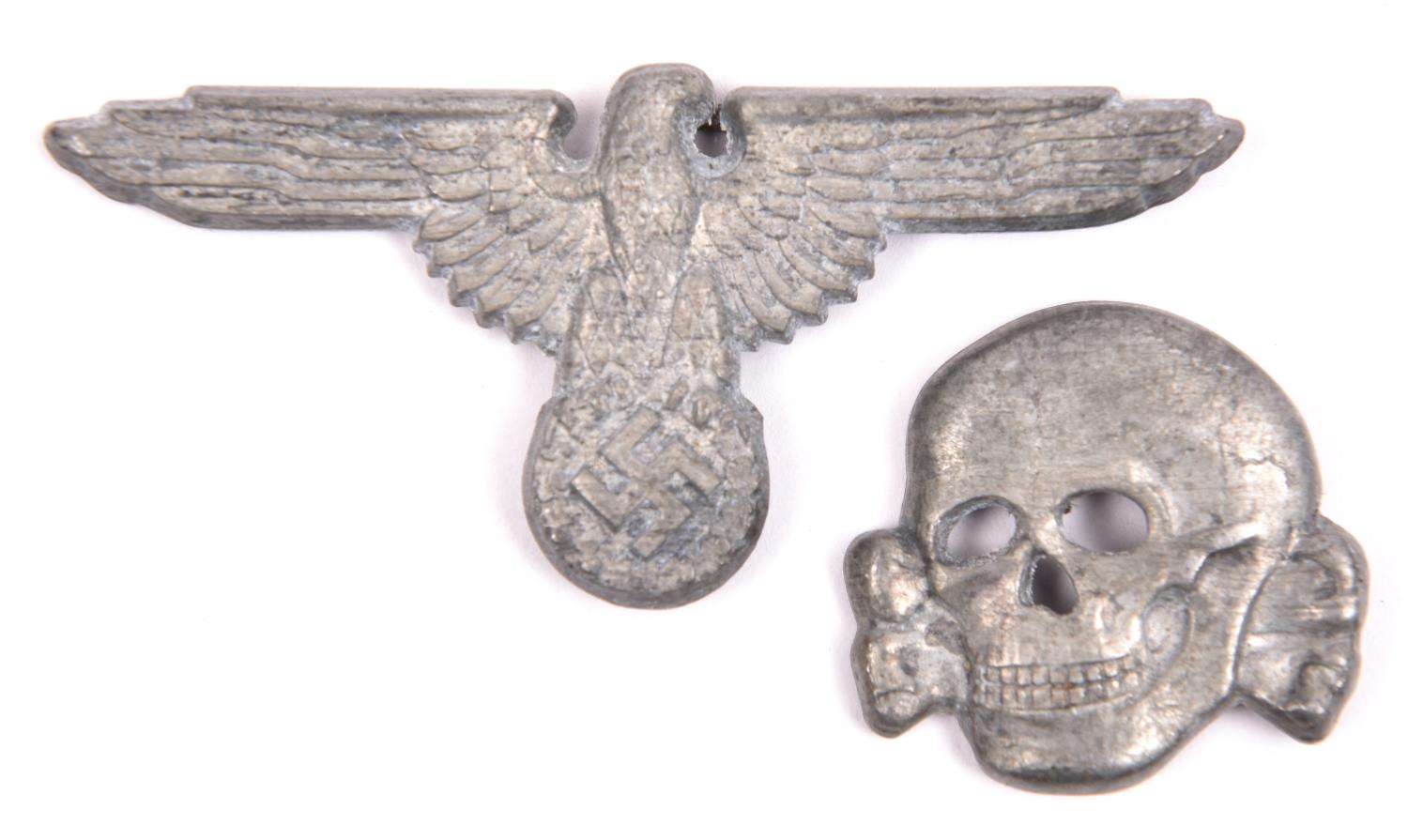 A Third Reich SS cap eagle and skull, both bearing RZM mark and “SS runes 475/43”. GC (some