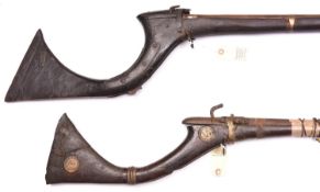 2 Indian matchlock guns from Sindh, 55” and 62” overall, with typical broad curved butts, one butt