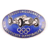 A Third Reich oval silver and enamelled pin back badge, depicting an Auto Union racing car above the
