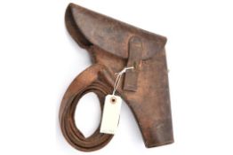 A scarce WWII flap top leather holster for a flare pistol, with leather belt loop stamped “E