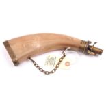A flattened horn flask with brass swivel charger, graduated nozzle 65-90, brass base cap and