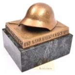A Swiss military shooting competition rectangular brass desk paperweight, surmounted by a steel