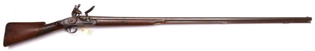 A late 18th century 8 bore flintlock fowling piece, 70” overall, barrel 53” engraved at breech “C.
