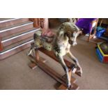 A traditional Victorian English produced children's hand carved wooden rocking horse. This is a 3/