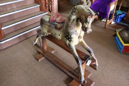 A traditional Victorian English produced children's hand carved wooden rocking horse. This is a 3/