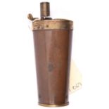 A copper 3 way pistol flask, with screw capped gilt brass base, top with swivel lid compartment