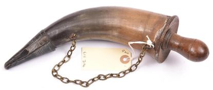 A powder horn, brass sprung nozzle, ring mounts and chain, darkwood base with screw plug, 11”