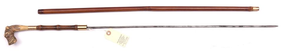 An early 20th century swordstick, slightly wavy round section blade 22½”, slender brown wood haft