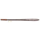 A Masai sword, seme, heavy, hollow diamond section blade 23”, swollen at point, plain wooden grip (