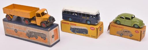 3 Dinky Toys. Volkswagen (181). In green with green wheels. B.O.A.C Coach (283). In blue & white,