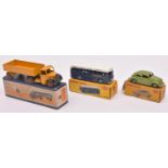3 Dinky Toys. Volkswagen (181). In green with green wheels. B.O.A.C Coach (283). In blue & white,