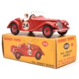 A Dinky Toys M.G. Midget Sports (102). Example in red with tan interior, RN24 and red wheels with