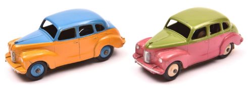 2 scarce Dinky Toys Austin Devon Saloon (152). An example in lime green and cerise with cream wheels