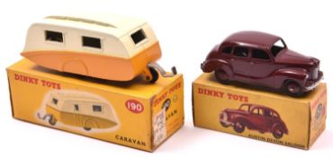 2 Dinky Toys. An Austin Devon Saloon (152) in maroon with maroon wheels and black tyres. Plus a