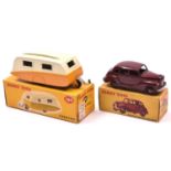 2 Dinky Toys. An Austin Devon Saloon (152) in maroon with maroon wheels and black tyres. Plus a