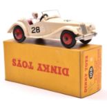 A Dinky Toys M.G. Midget Sports (102). Example in creamy white with maroon interior, RN28 and red