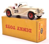 A Dinky Toys M.G. Midget Sports (102). Example in creamy white with maroon interior, RN28 and red