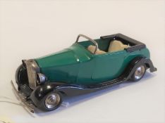 A rare Tri-ang Minic clockwork Bentley Type Tourer 37M. A non electric example in bright green and