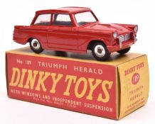 A rare Dinky Toys Triumph Herald (189). A Triumph dealer's promotional example in red. Boxed.