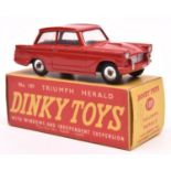 A rare Dinky Toys Triumph Herald (189). A Triumph dealer's promotional example in red. Boxed.