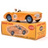 Dinky Toys Austin Healey '100' Sports (109). In deep yellow with mid blue interior, mid blue