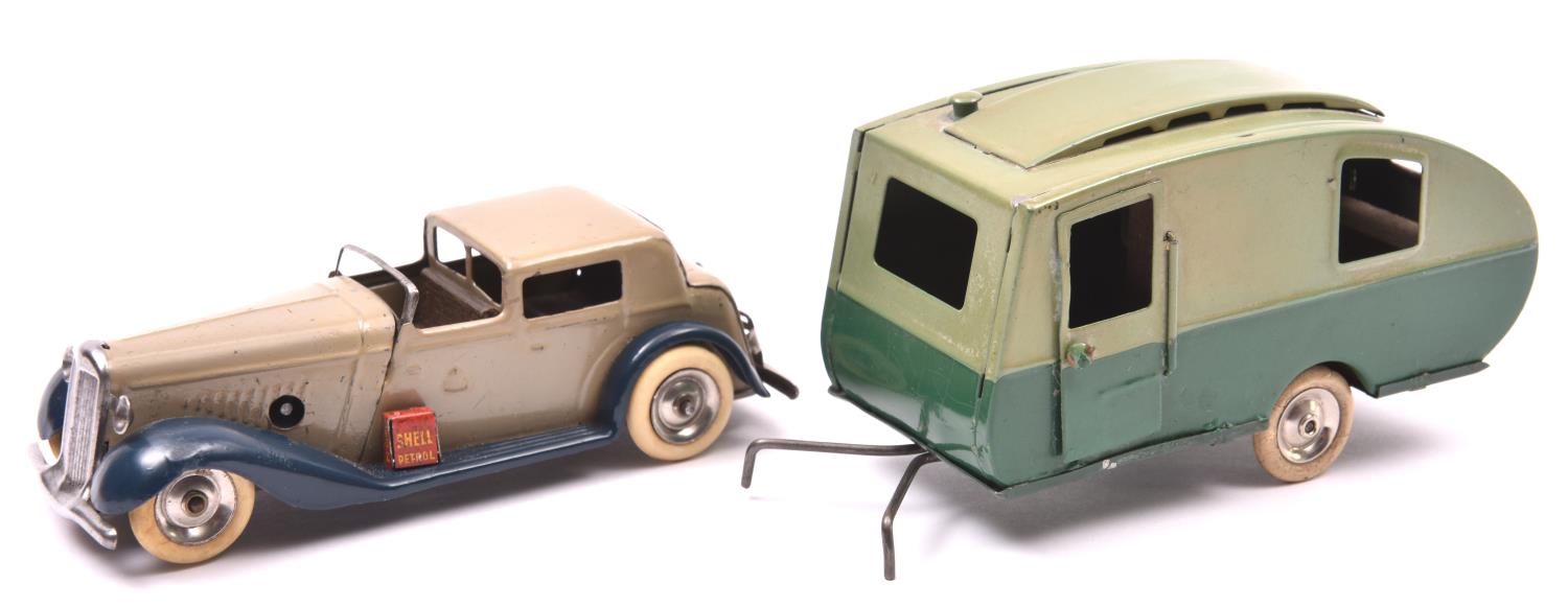 2 Tri-ang Minic tinplate toys. A clockwork Town Coupe No.7m An example in light grey with dark