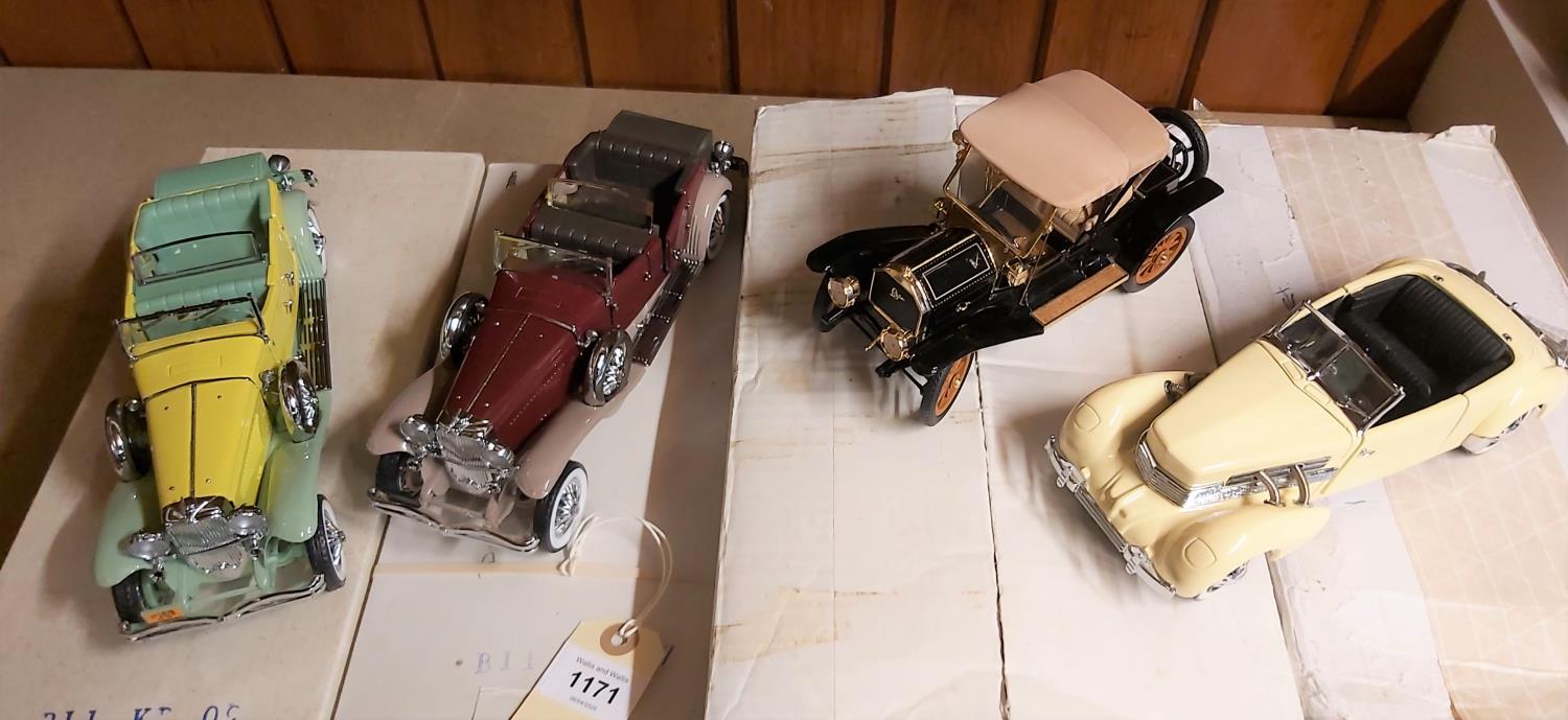 4 Franklin Mint vehicles. 1910 Cadillac Model Thirty Roadster. In black. 1937 Cord 812 Phaeton