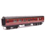 An O Gauge Exley K6 type LMS Brake Third. In lined maroon livery. GC-VGC, non-original bogies and