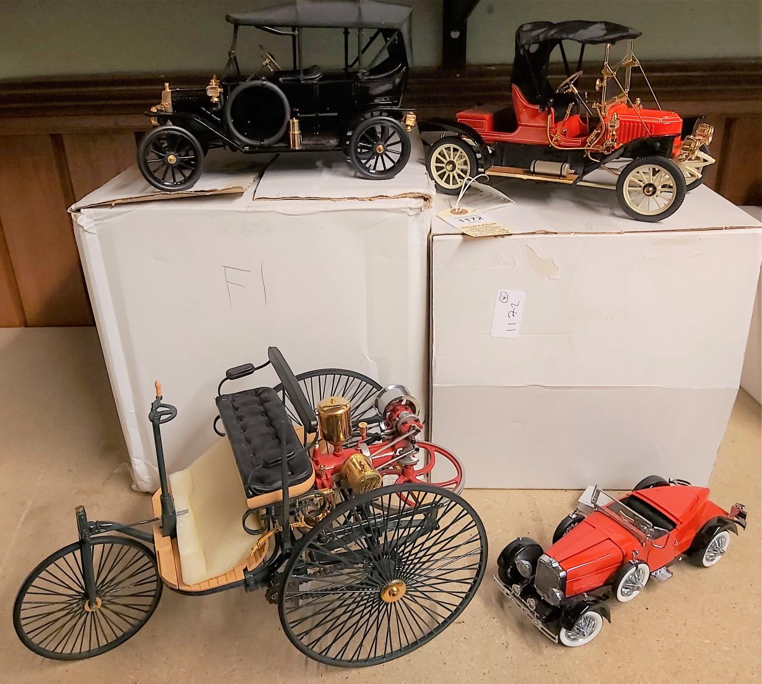 4 Franklin Mint vehicles. 1896 Benz Patent Motorwagen. In red & black. 1911 Stanley Steamer 62
