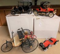 4 Franklin Mint vehicles. 1896 Benz Patent Motorwagen. In red & black. 1911 Stanley Steamer 62