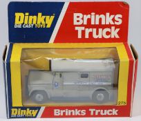 A Dinky Toys US issue Brinks Truck (275). Example with grey body, light grey roof and blue