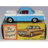 Corgi Toys Triumph Herald Coupe (231). Example in light blue and white, with red interior, dished