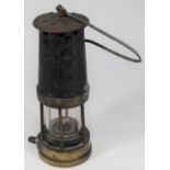 A Davy Miner's Lamp. Brass and steel construction with 212 stamped into brass reservoir section
