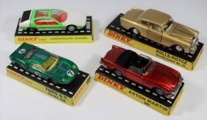 4 Dinky Toys. Aston Martin DB5 (110). In metallic red with black interior, spoked wheels and black
